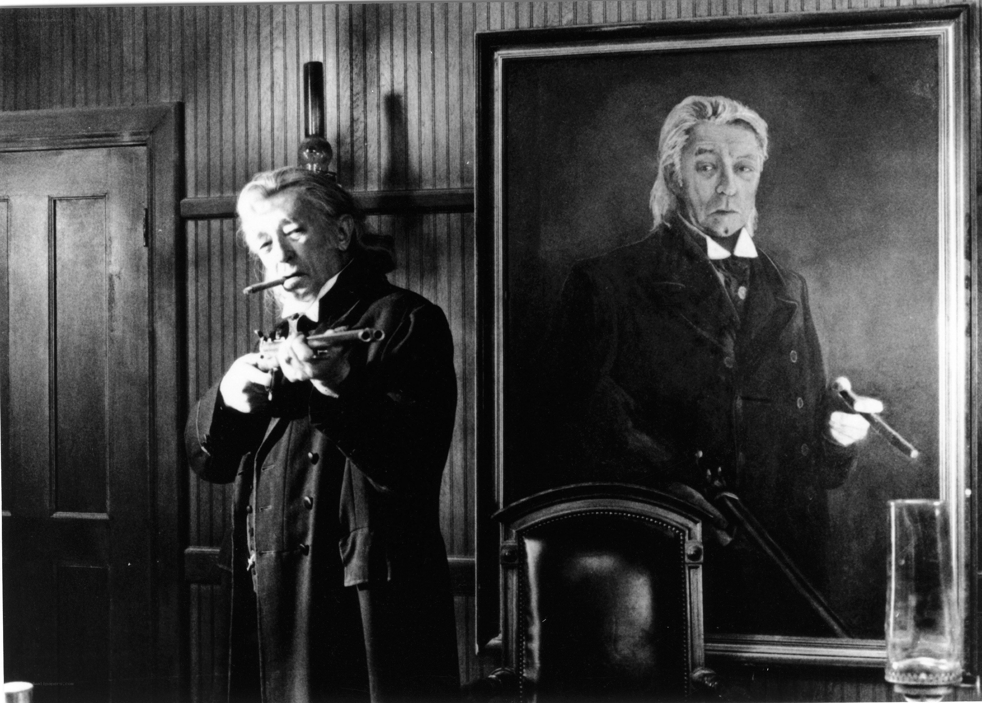 Man with gun and portrait
