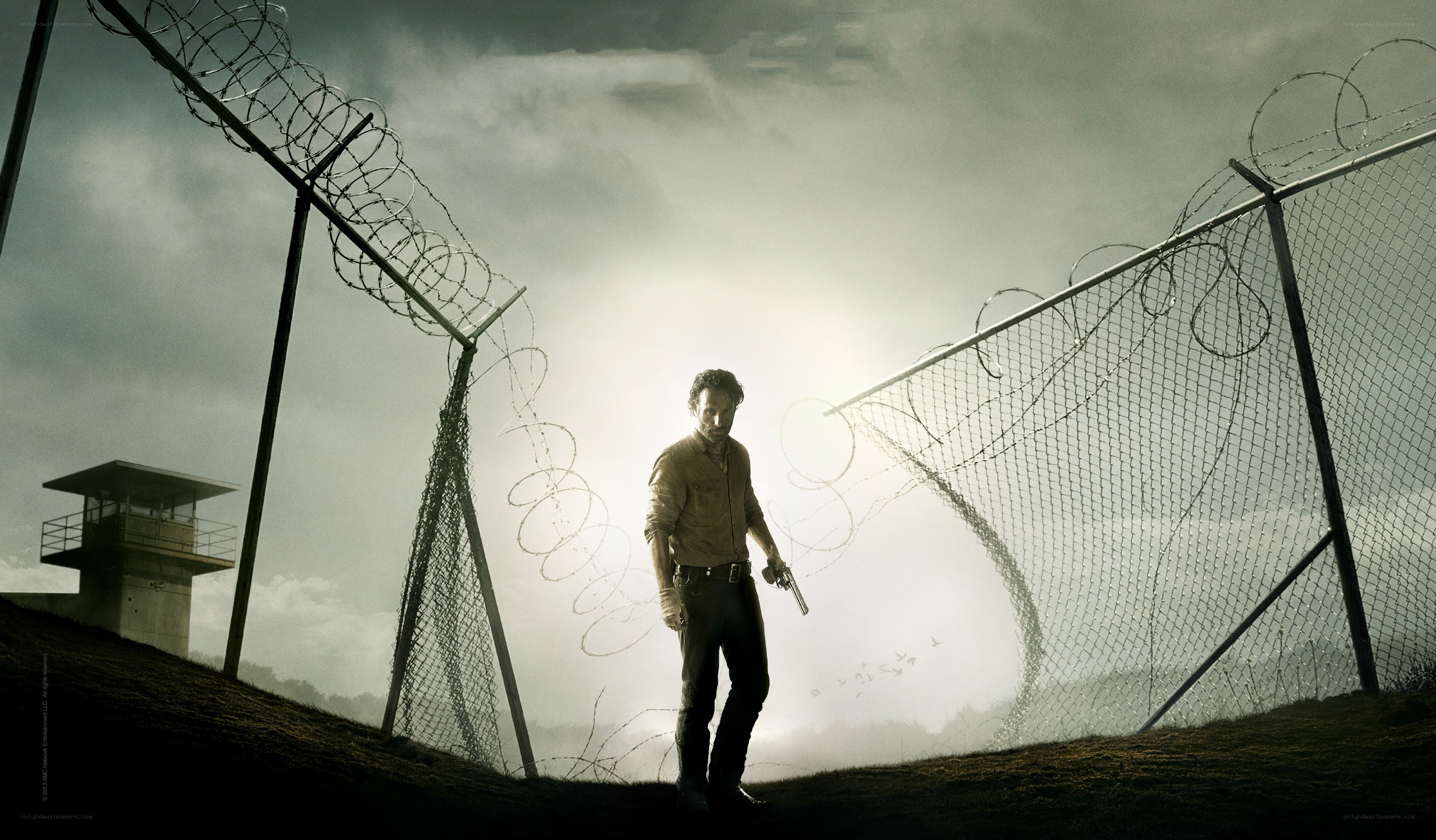 man with gun at prison gate