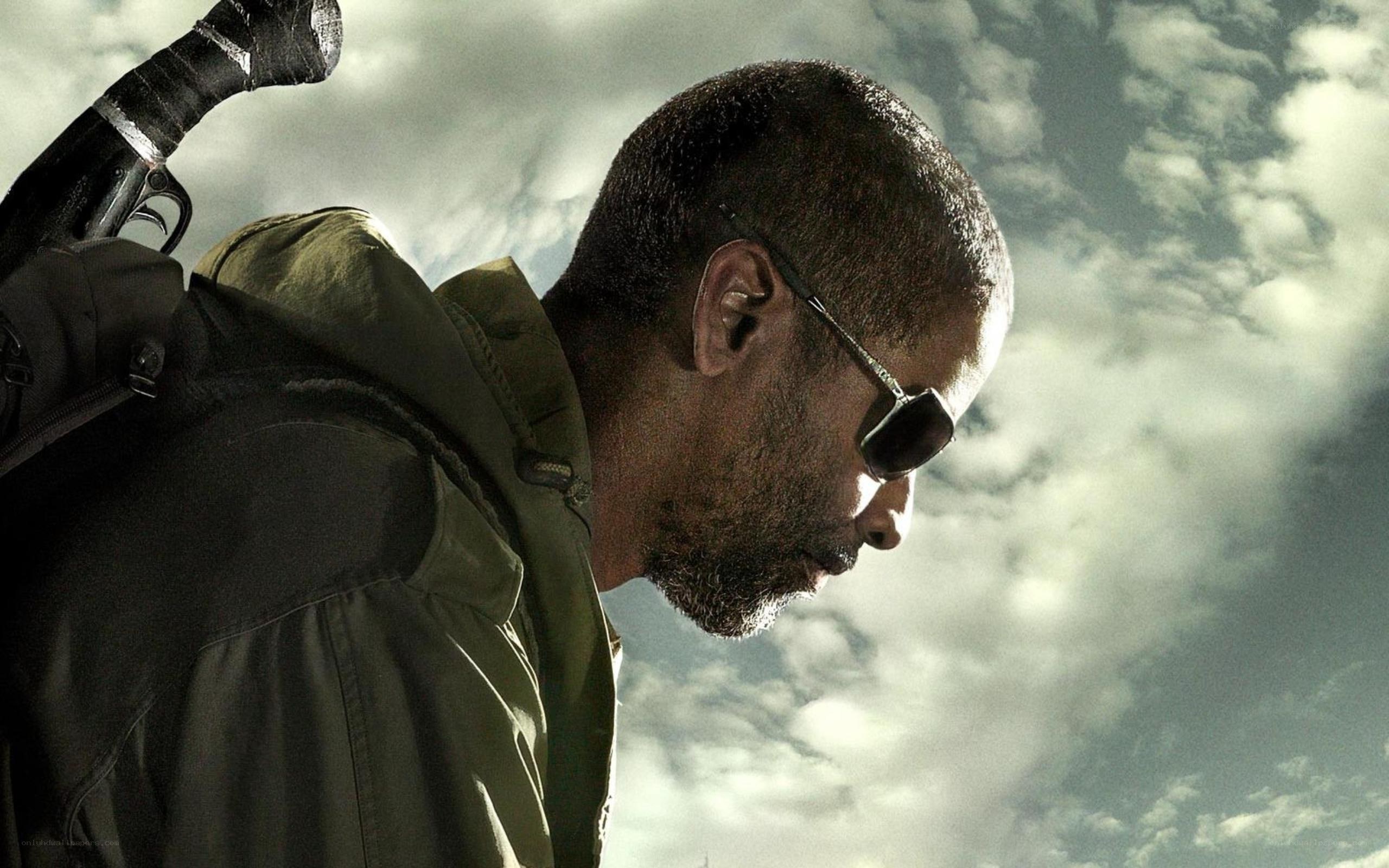 man with gun in cloudy sky