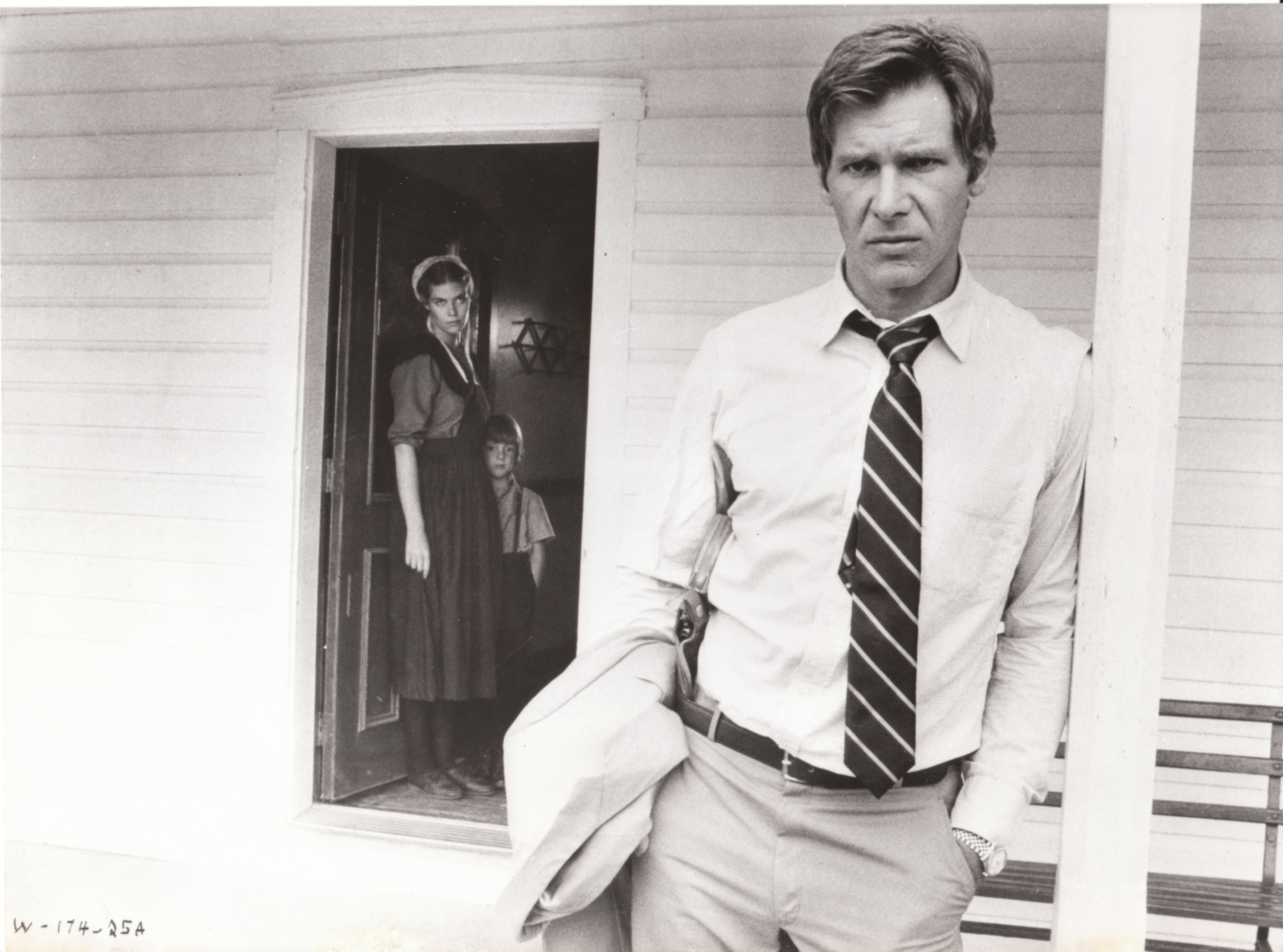 man with gun in doorway