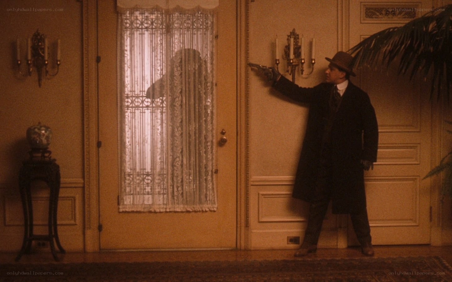 Man with gun in hallway