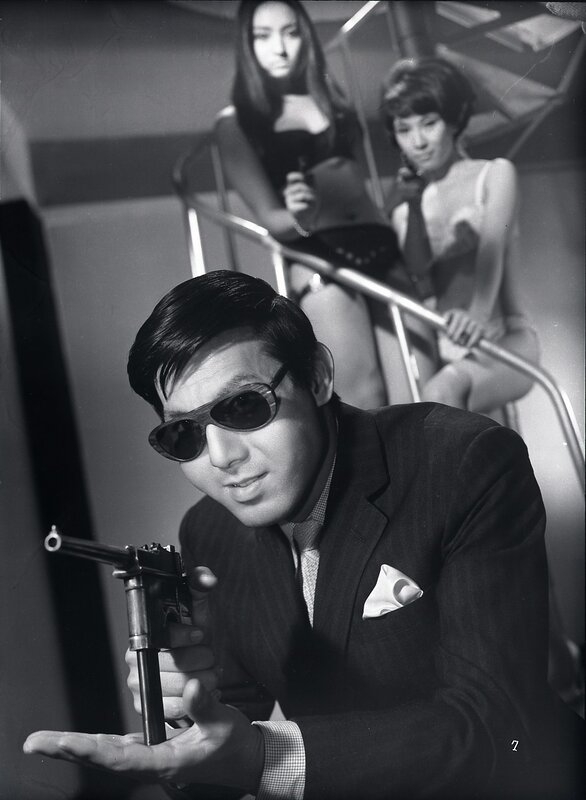 Man with gun in suit