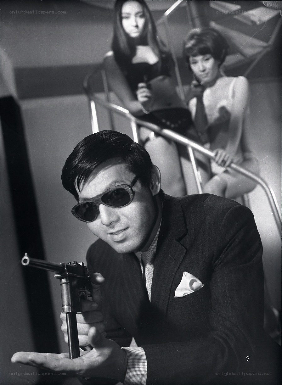 Man with gun in suit