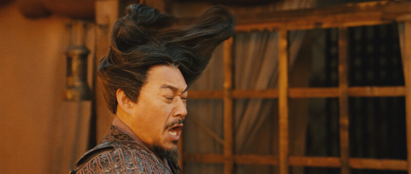 man with hair flying in wind