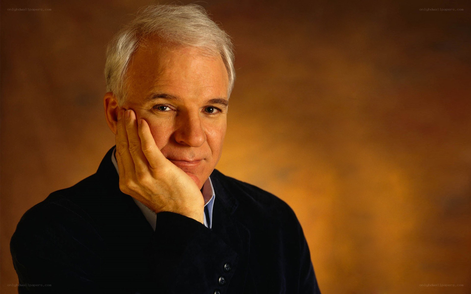 man with hand on cheek