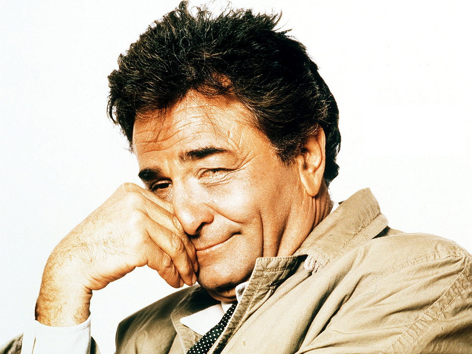 man with hand on chin