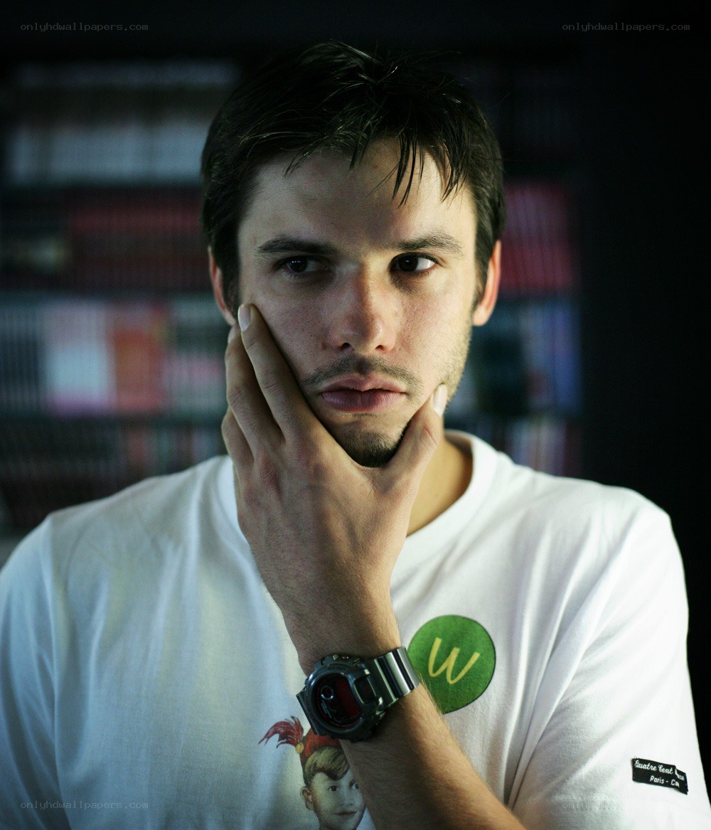 man with hand on chin