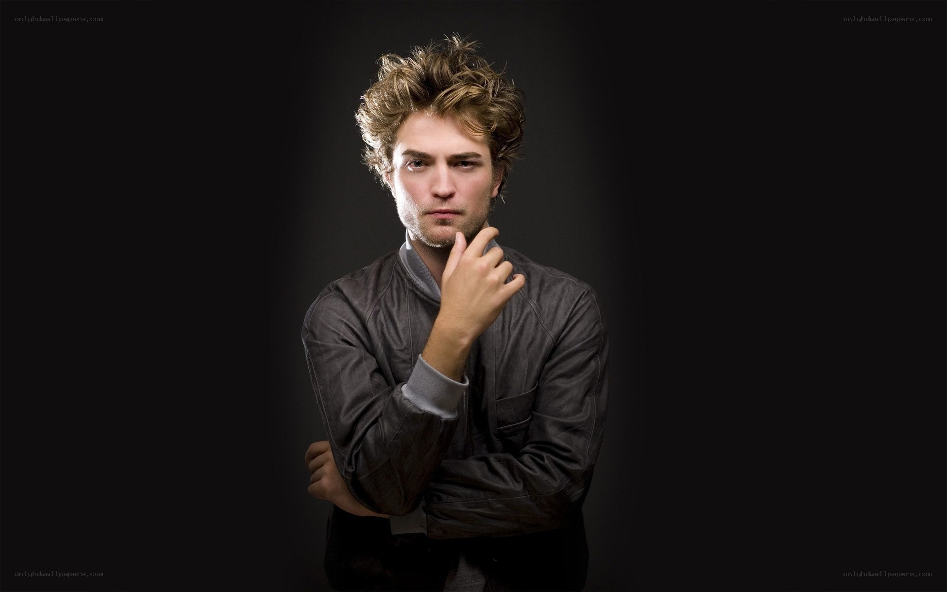 man with hand on chin