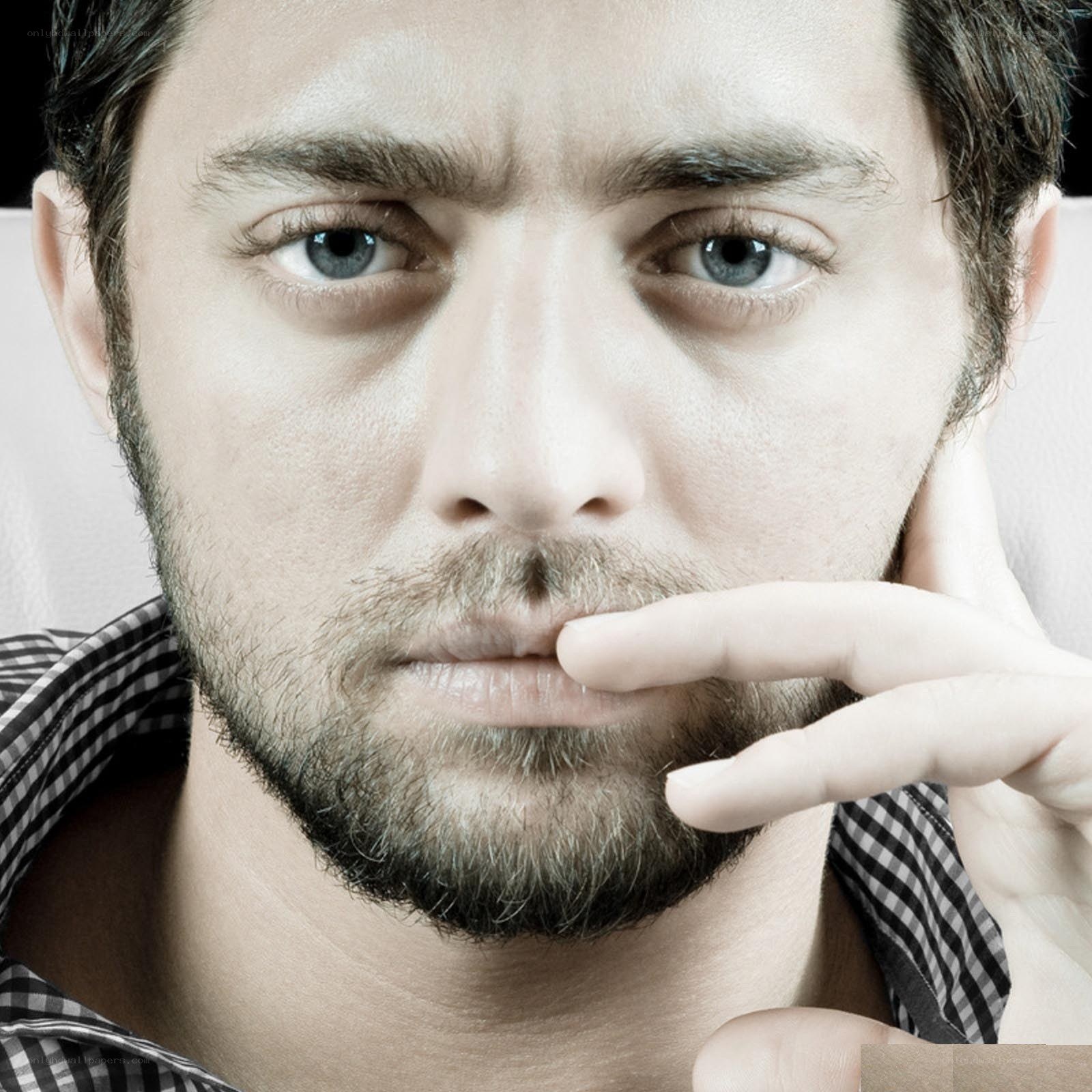 man with hand on chin
