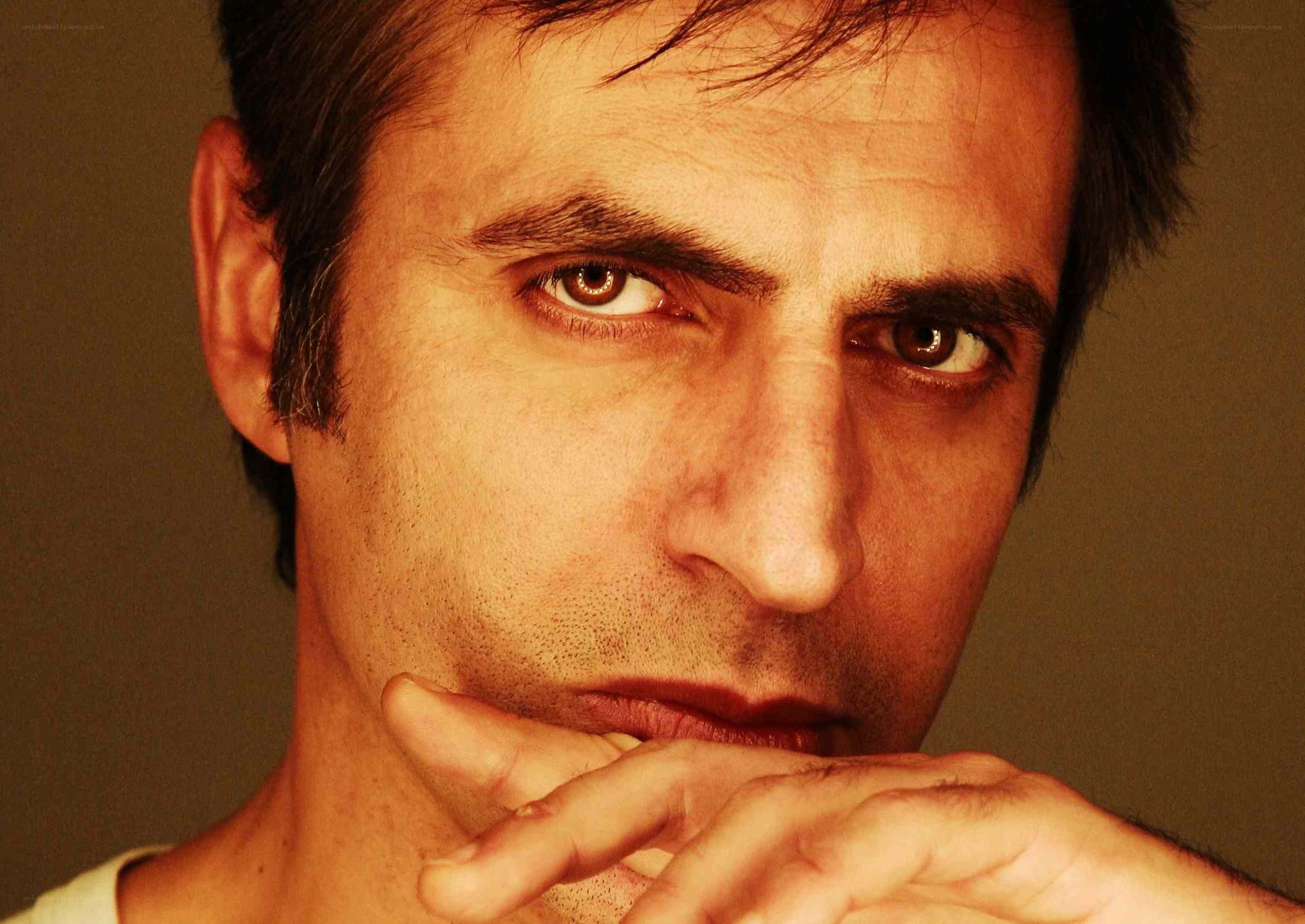 man with hand on chin