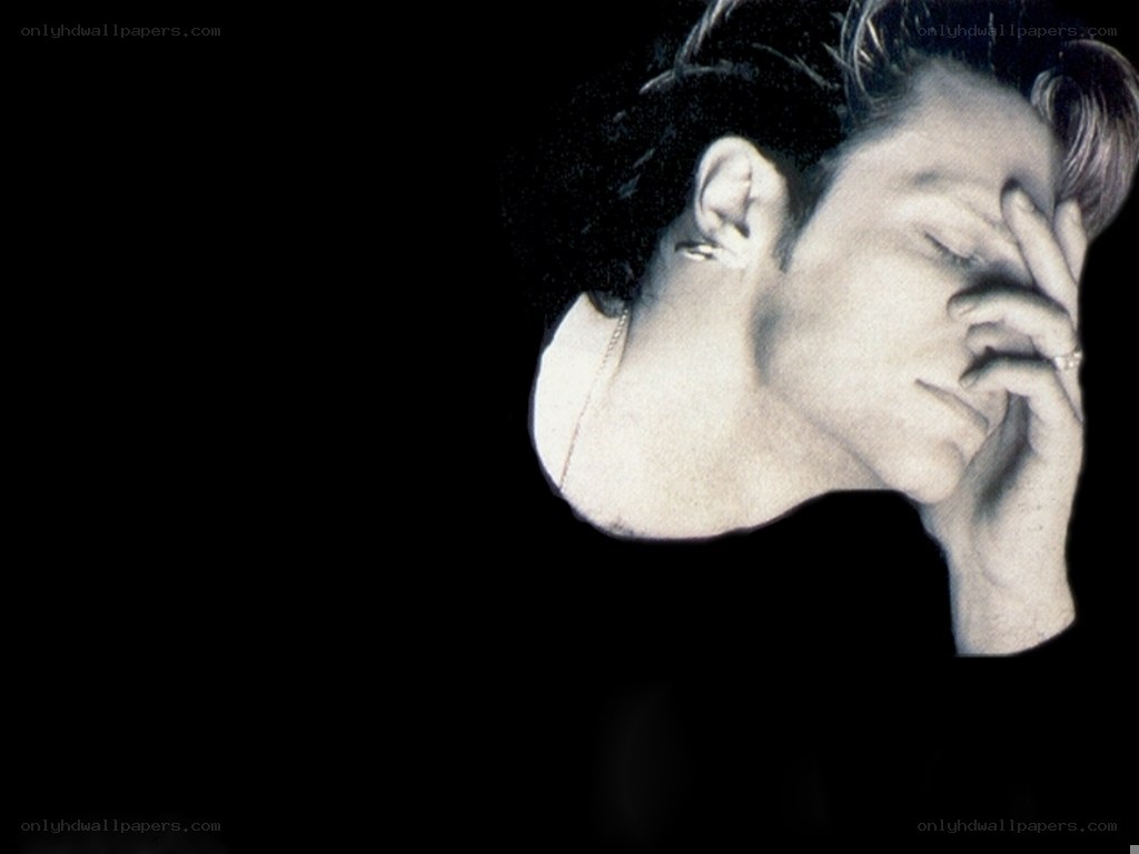 man with hand on face
