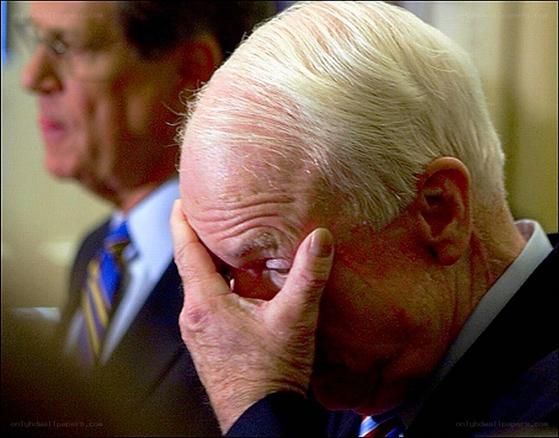 Man with hand on face
