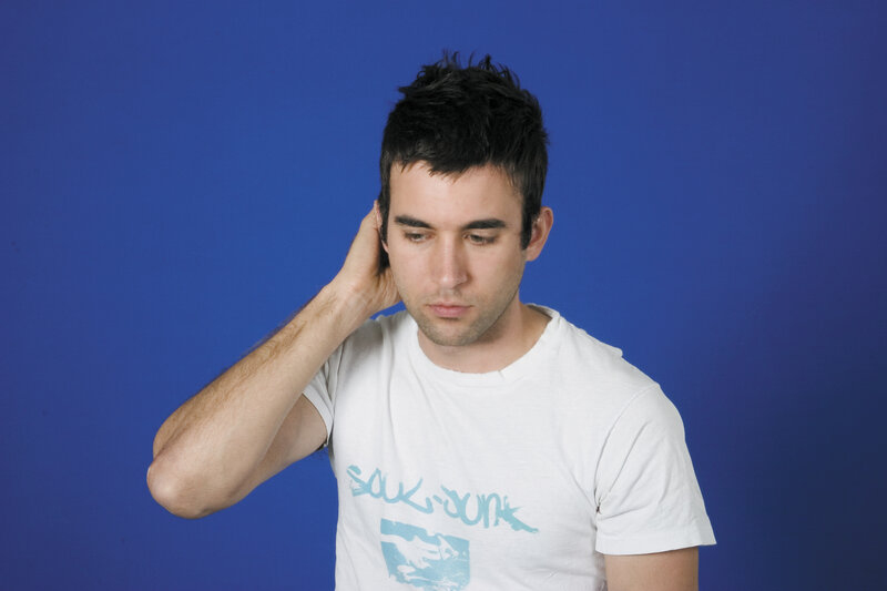 man with hand on head