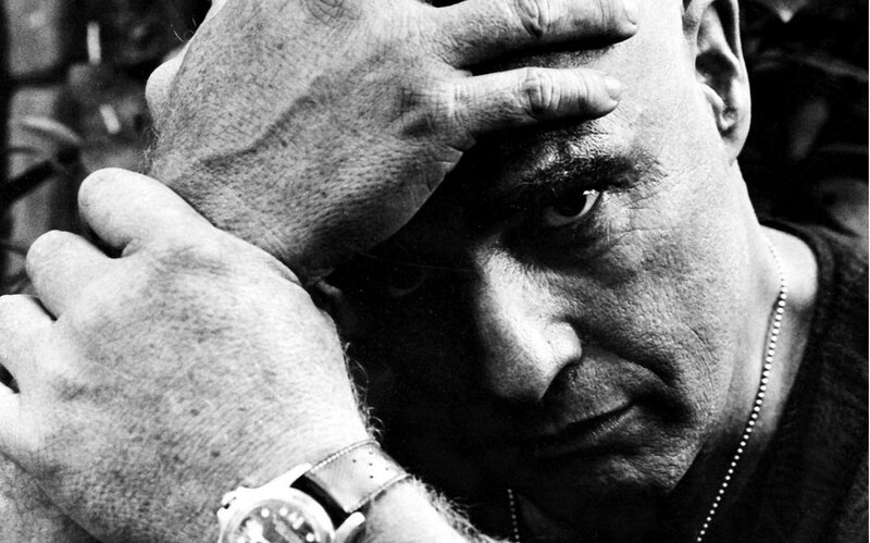 man with hands on face