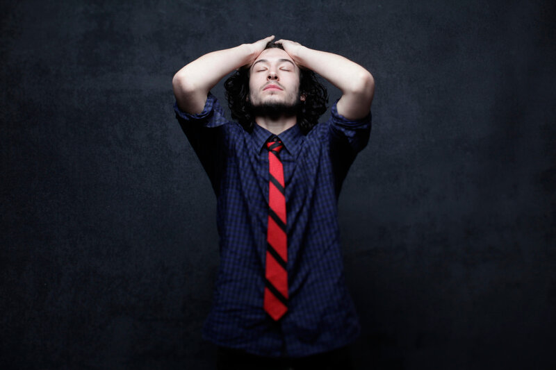 man with hands on head