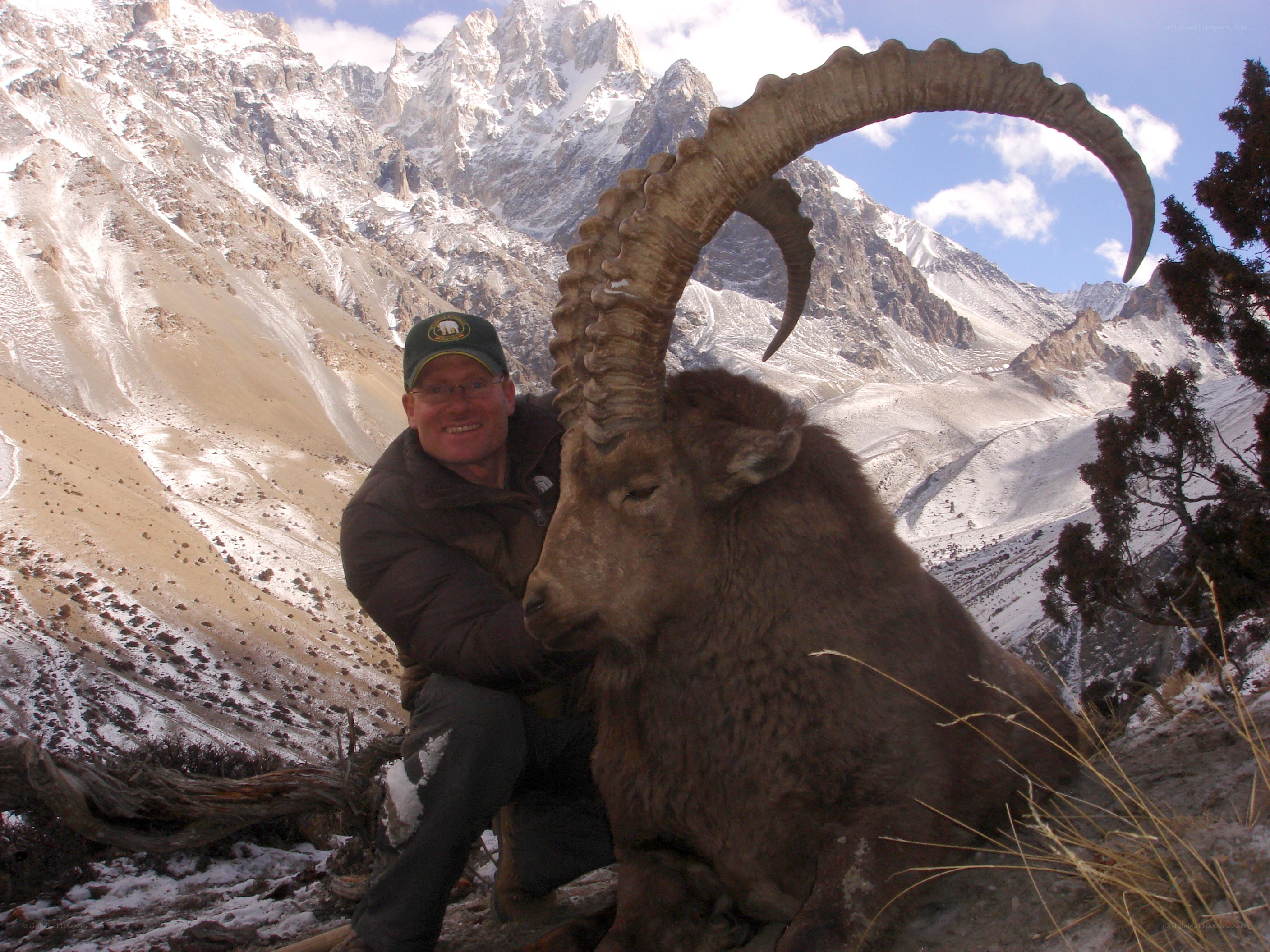 Man with harvested mountain goat