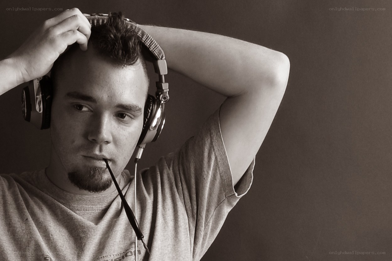 man with headphones adjusting