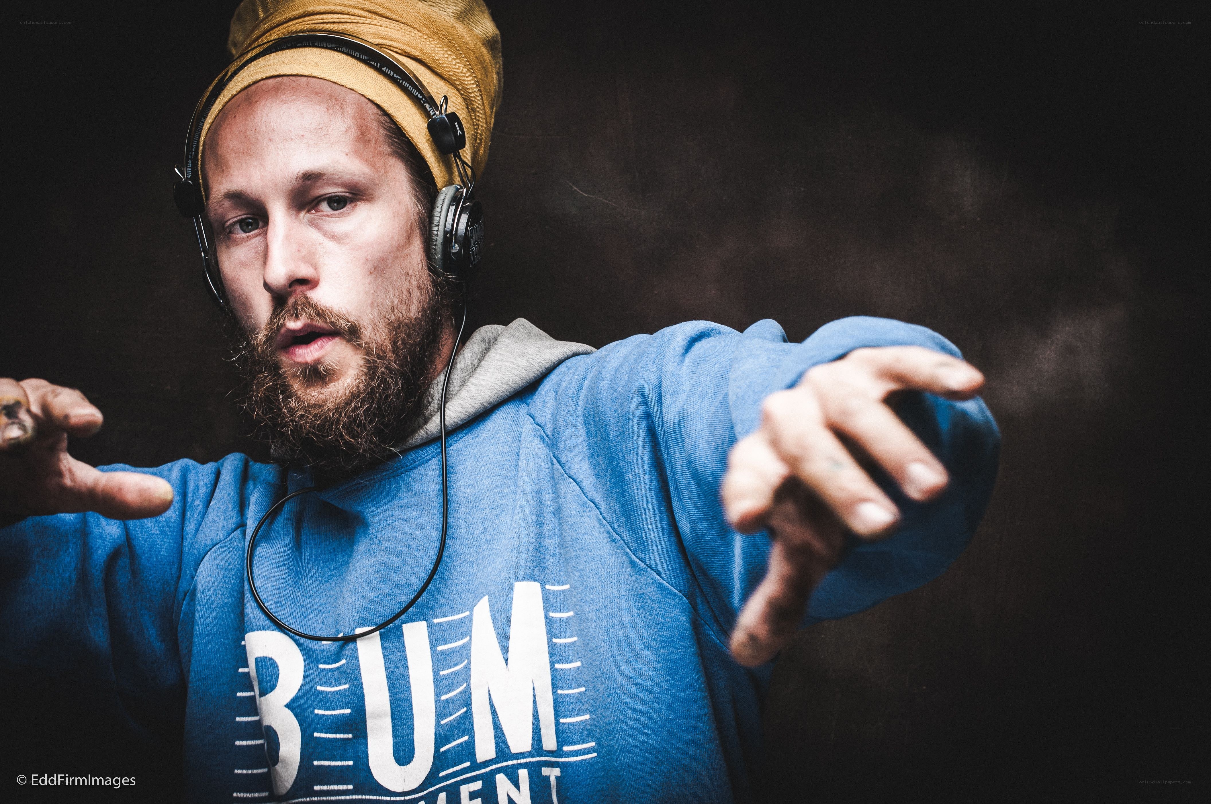 man with headphones and beard