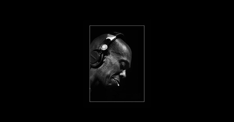 man with headphones and cigarette