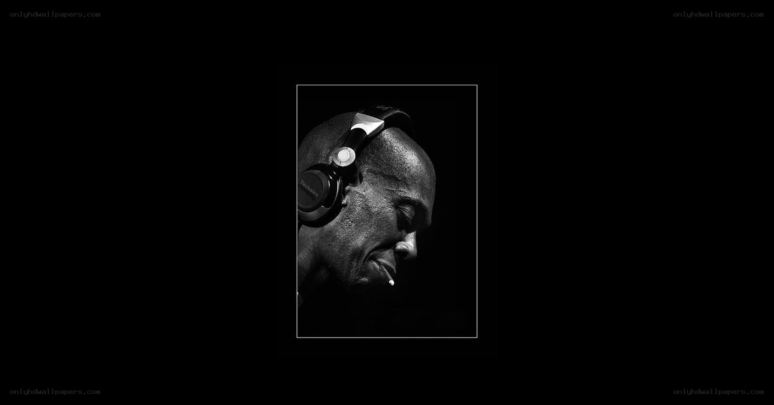 man with headphones and cigarette
