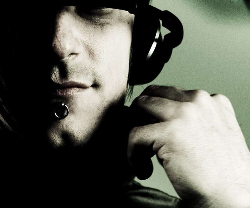 man with headphones and lip piercing