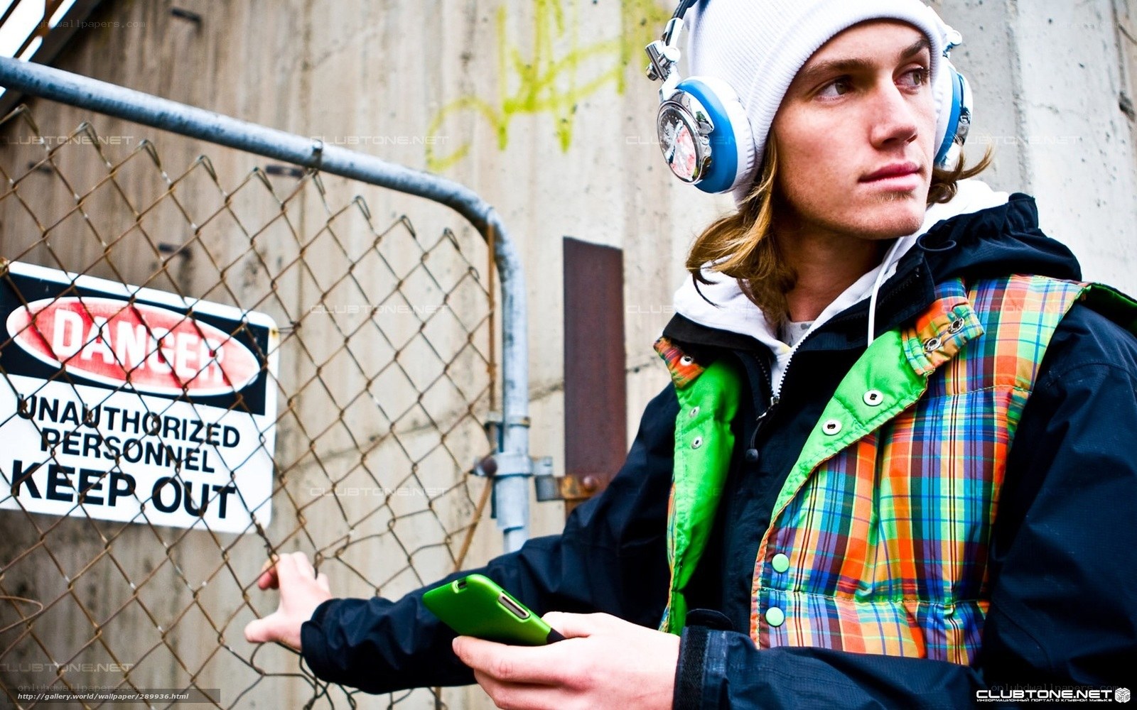 man with headphones and phone
