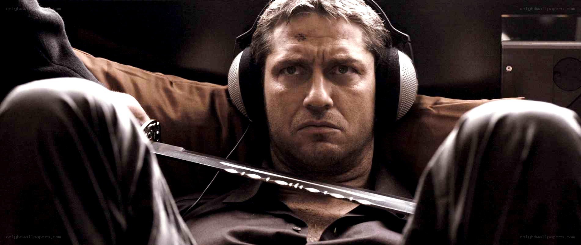 man with headphones and sword