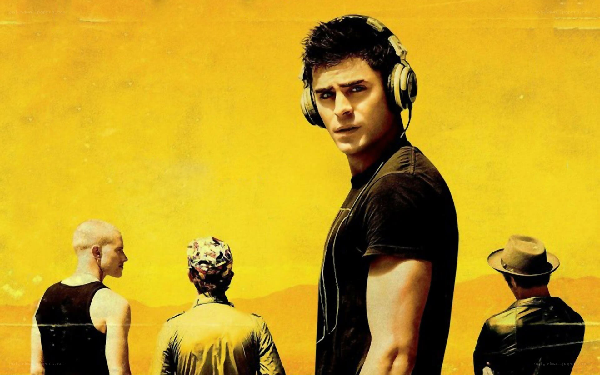 man with headphones in desert
