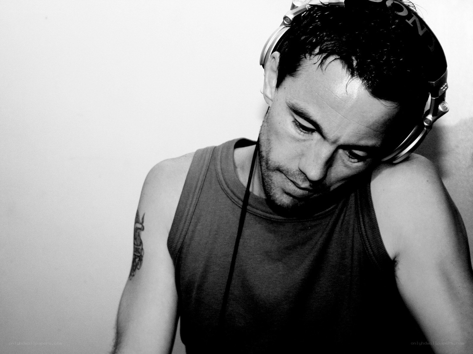 man with headphones looking down
