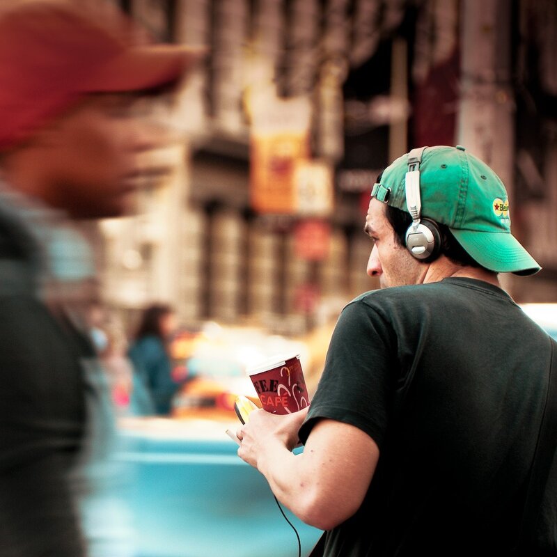 Man with headphones on street