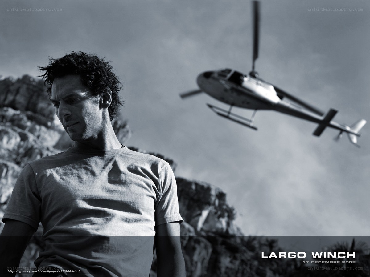 Man with helicopter in background