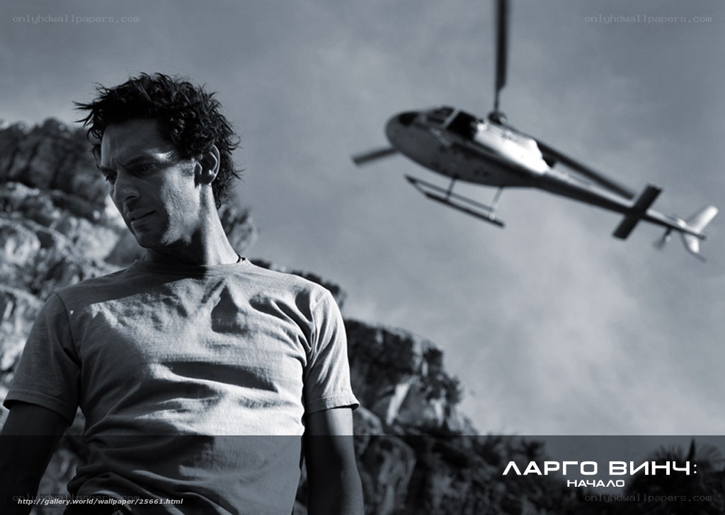 Man with helicopter in background