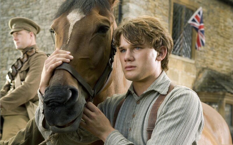 man with horse in military setting