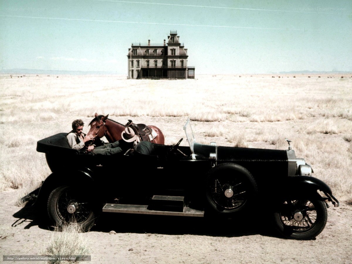 Man with horse in vintage car
