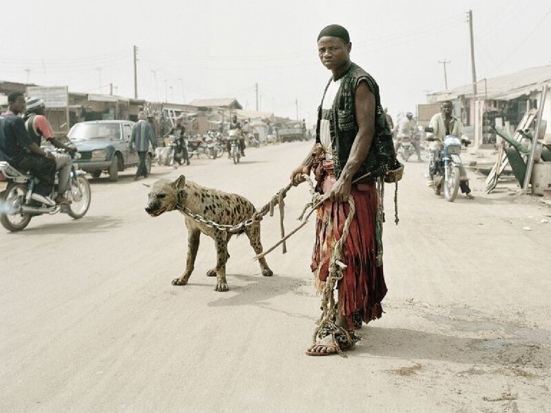 Man with hyena on a leash