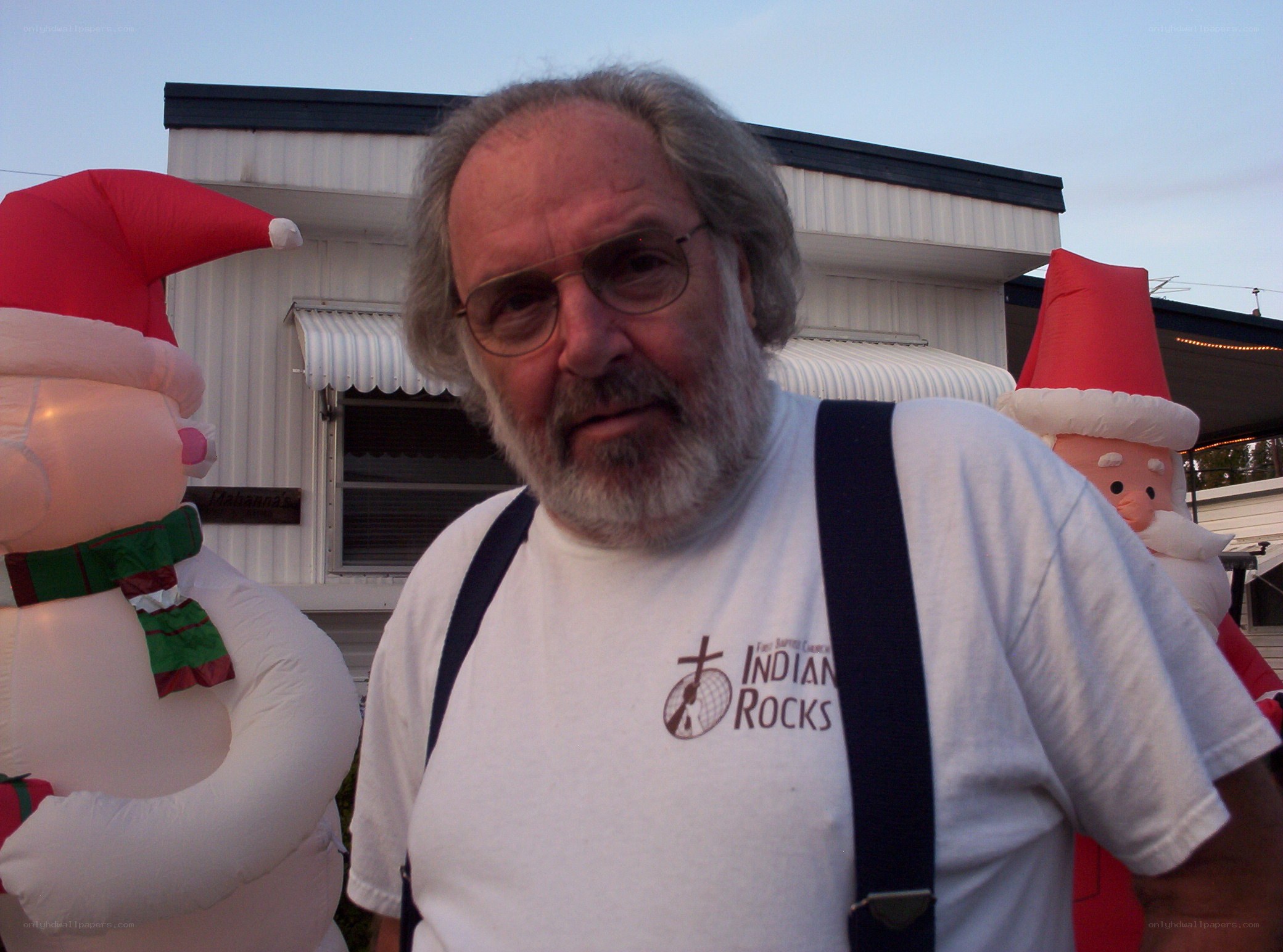 man with inflatable santas