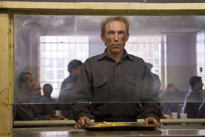 Man with injured face in prison