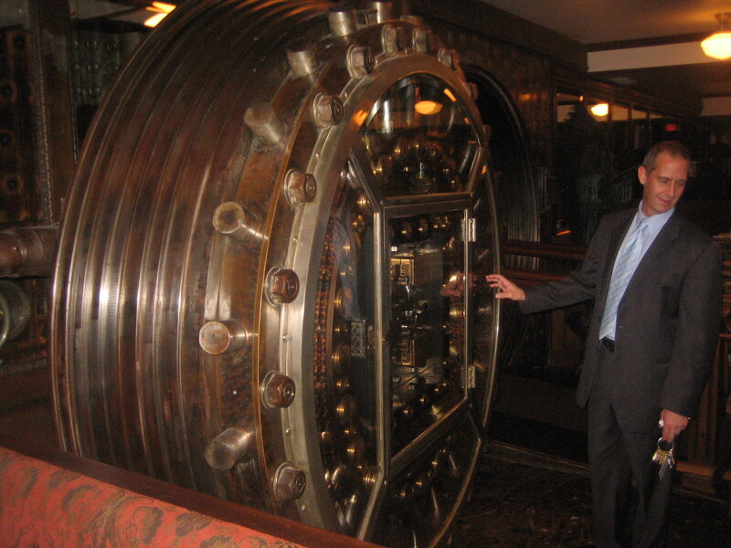 Man with keys near vault door