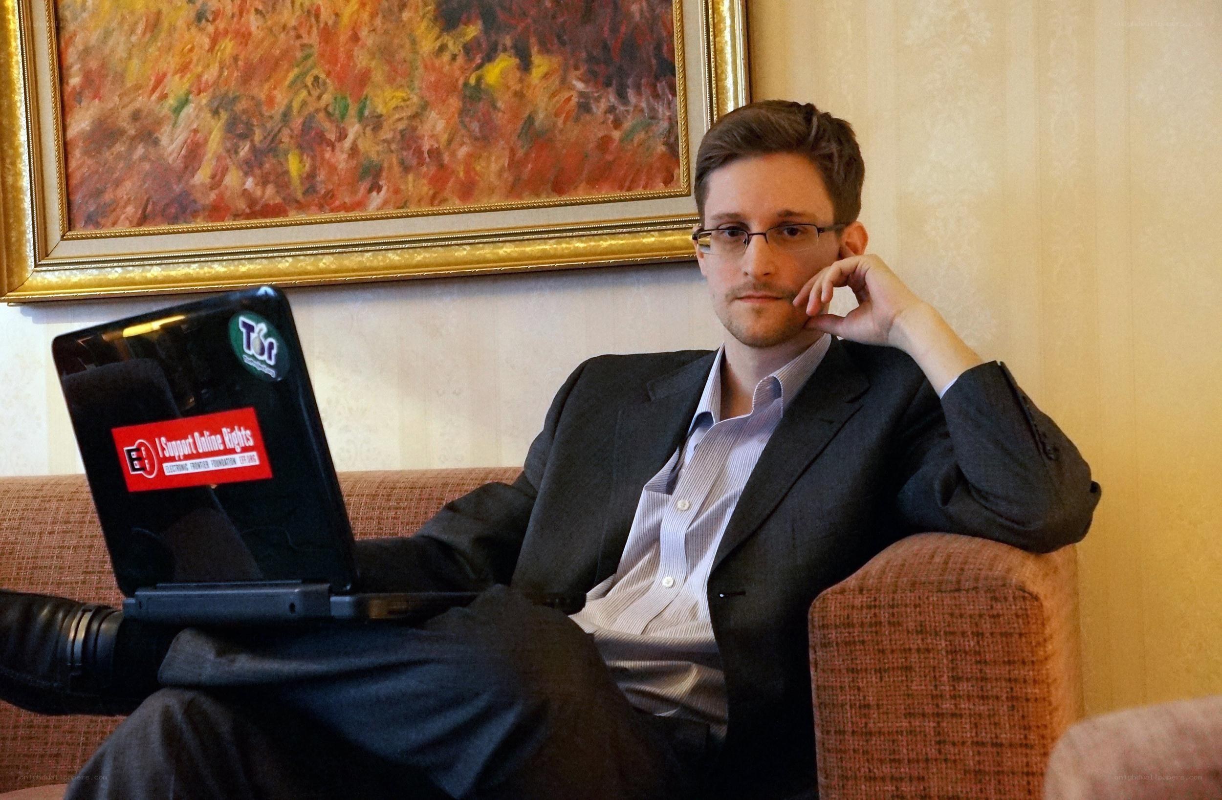 Man with laptop on couch