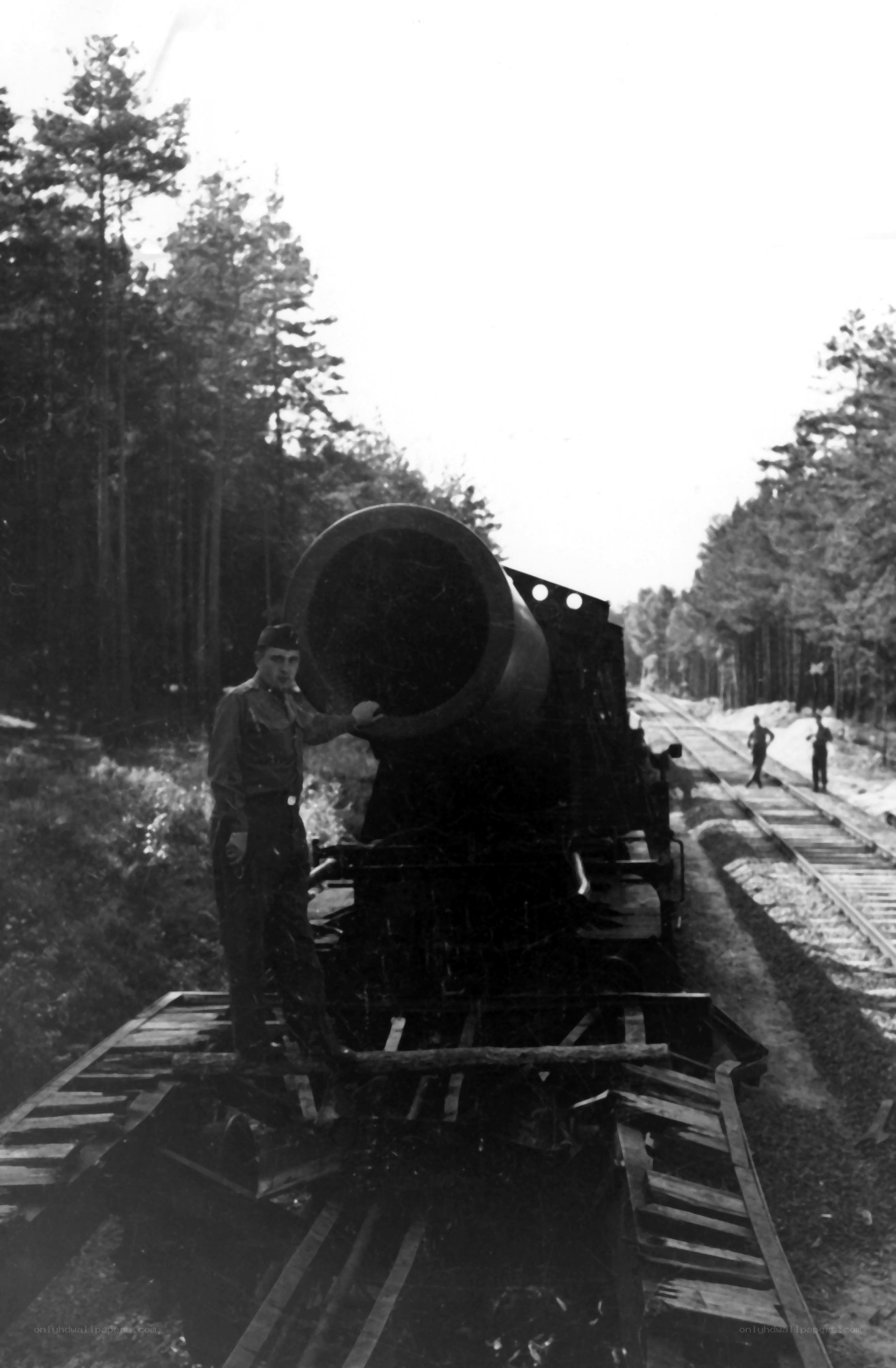Man with large cannon on train
