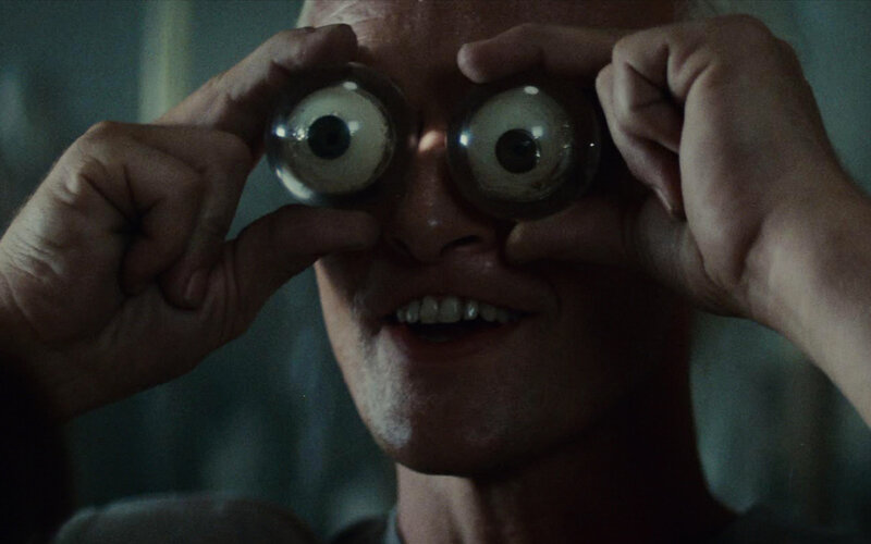man with large eyes prop