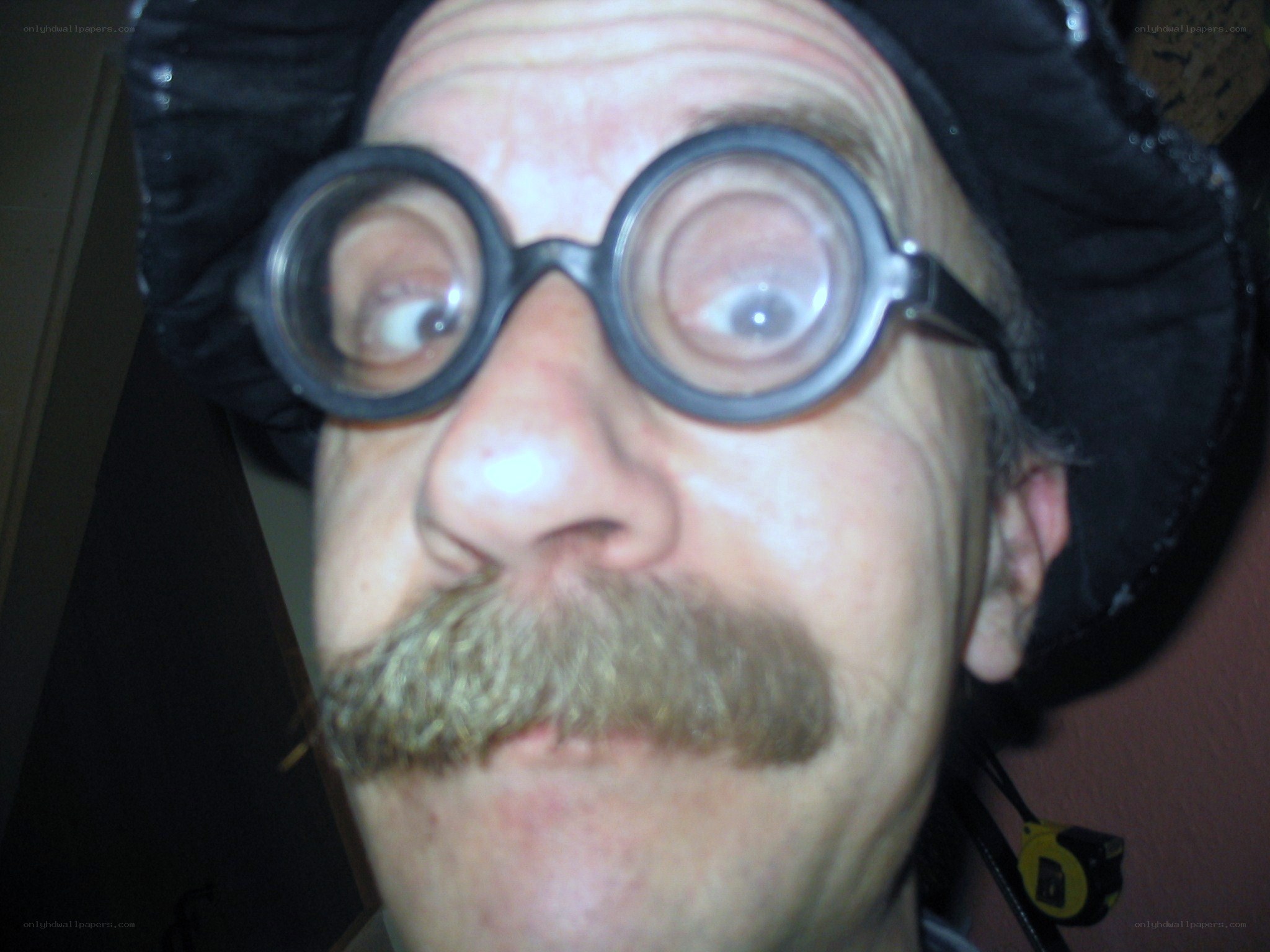 man with large glasses and mustache