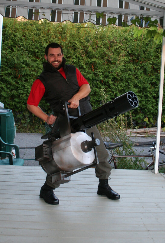 Man with large weapon prop