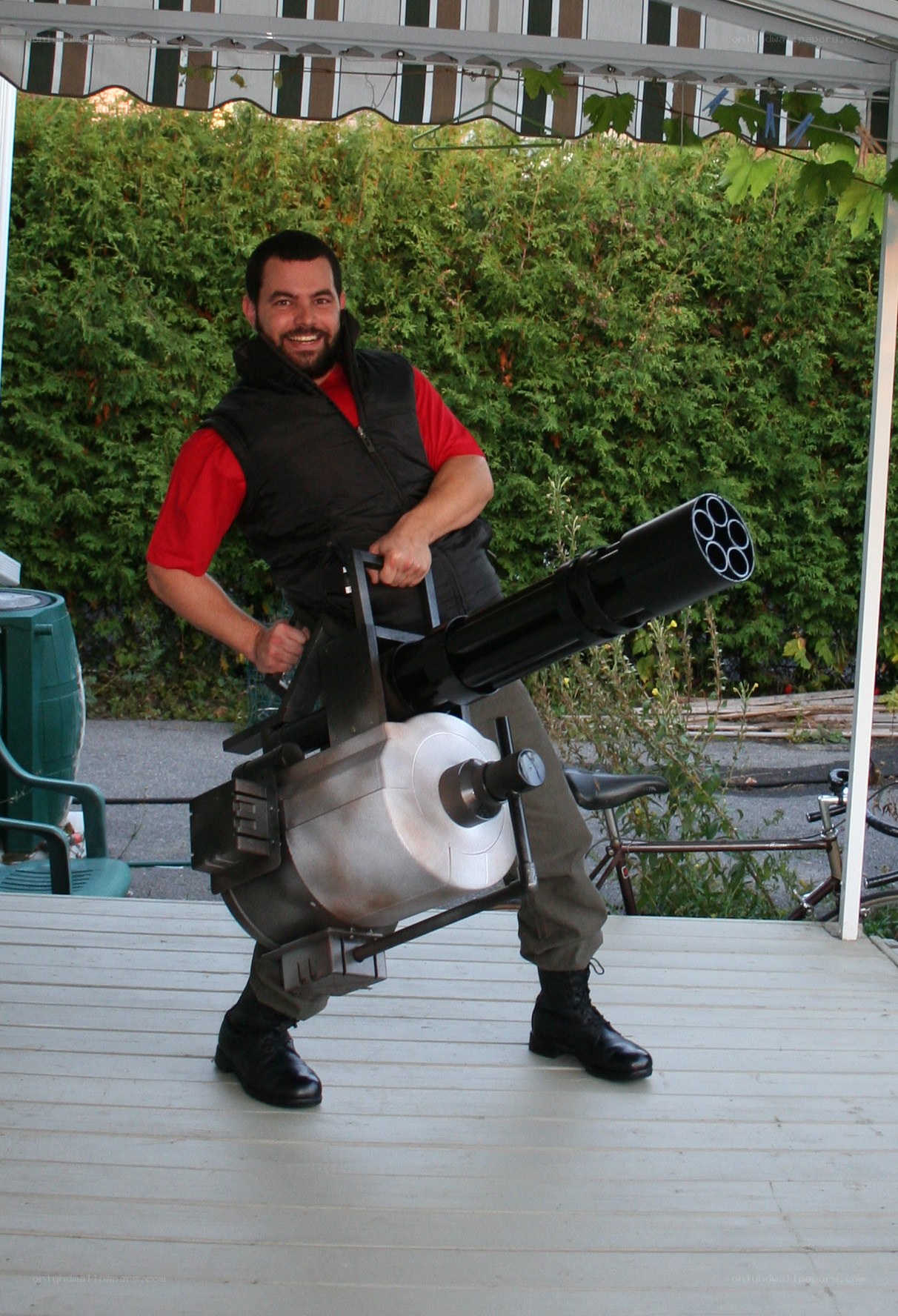 Man with large weapon prop