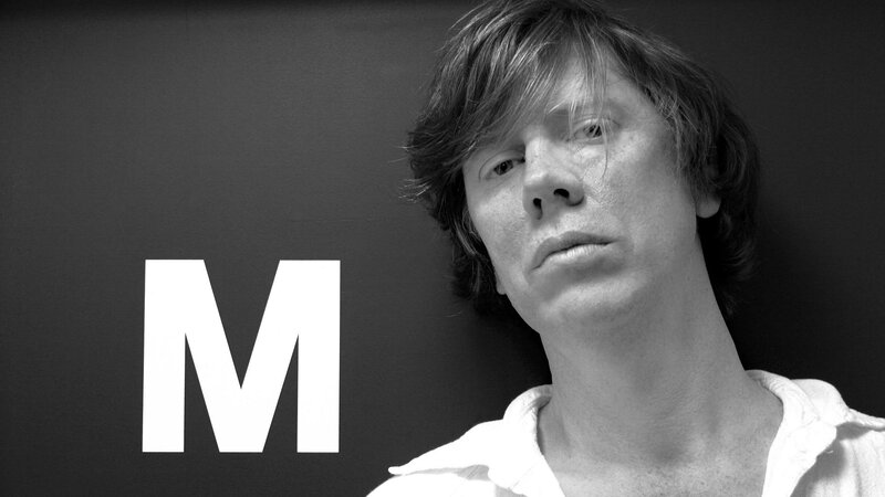 Man with letter M