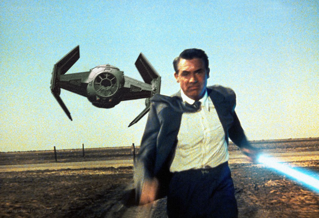 man with lightsaber and tie fighter