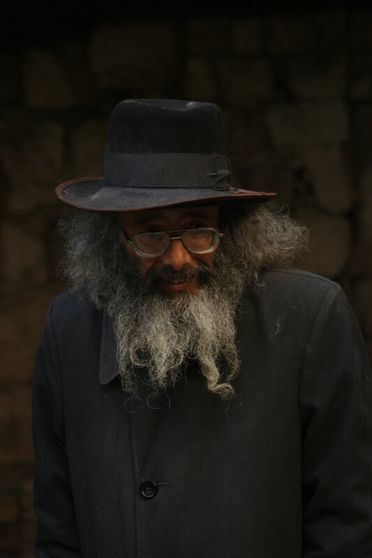 man with long beard and hat