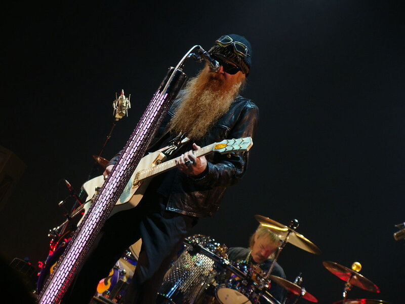 Man with Long Beard Playing Guitar
