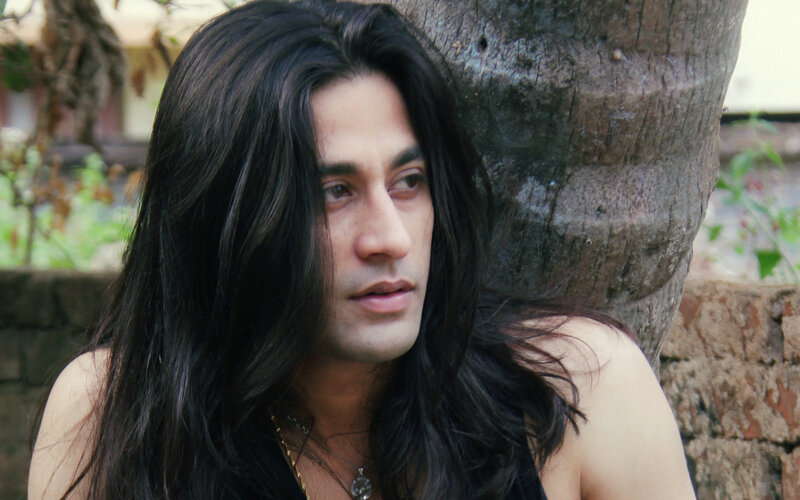 Man with Long Black Hair — Contemplative
