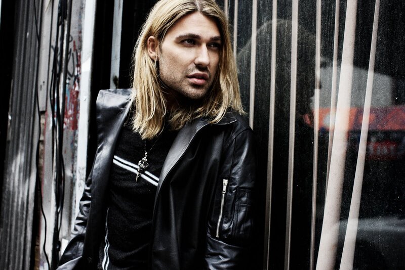 Man with Long Blonde Hair — Black, Serious